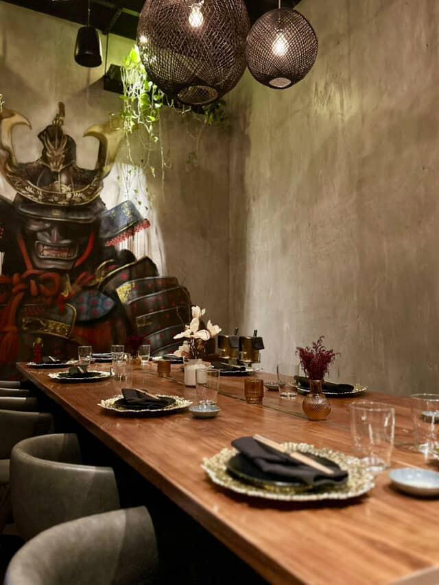 Azabu private room table beside samurai mural