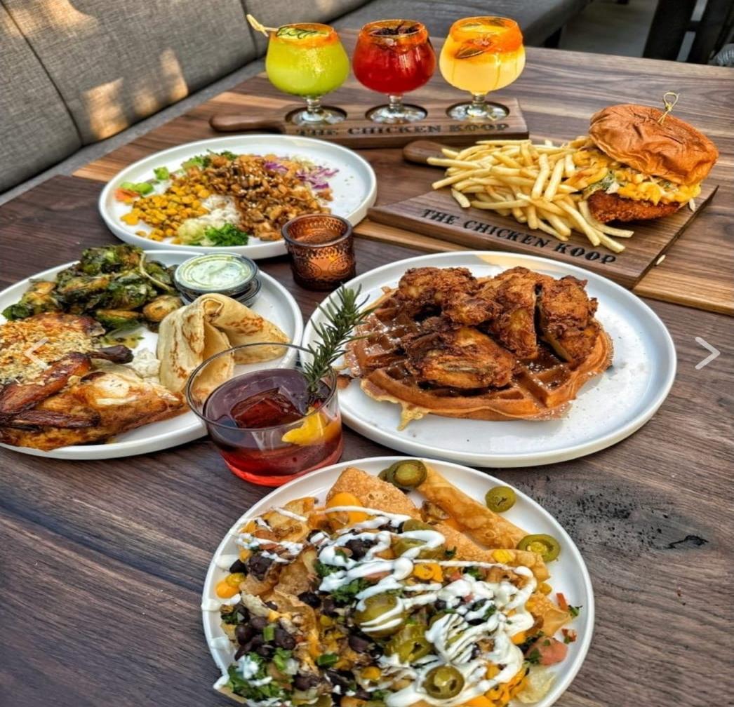 The Chicken Koop family style feast spread with cocktail flight