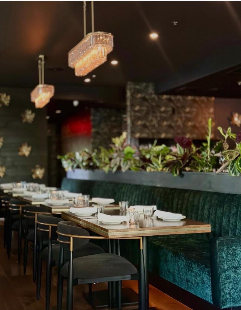 NYX Steakhouse green booths and dining tables