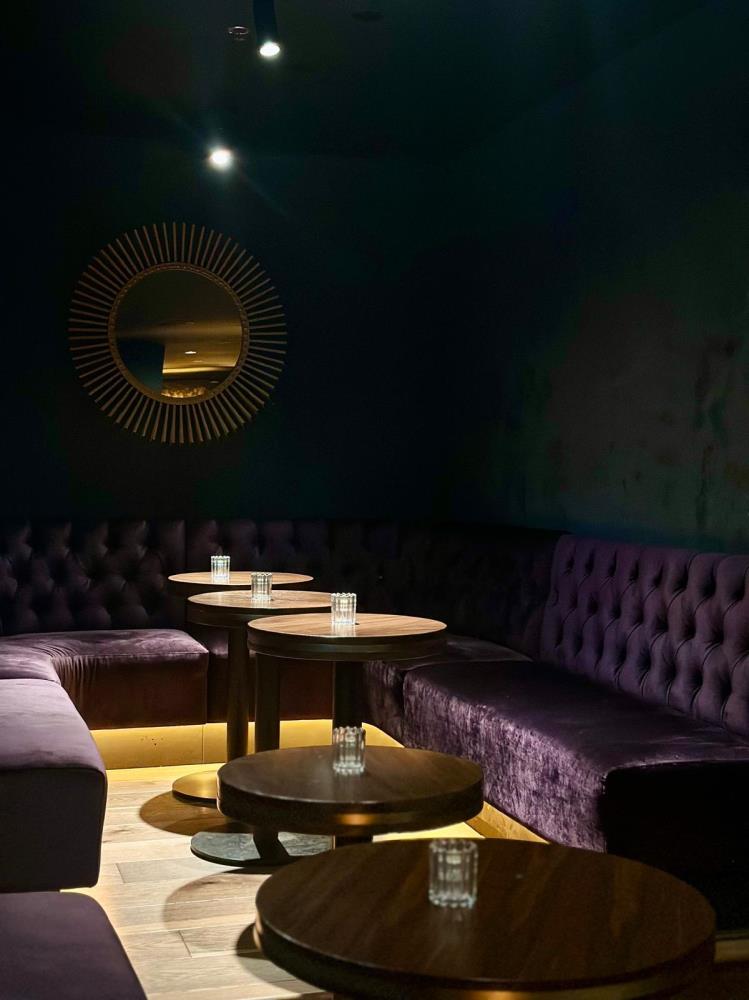 Room 214 purple velvet lounge seating