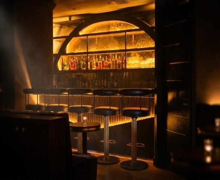 Room 214 glowing arched bar