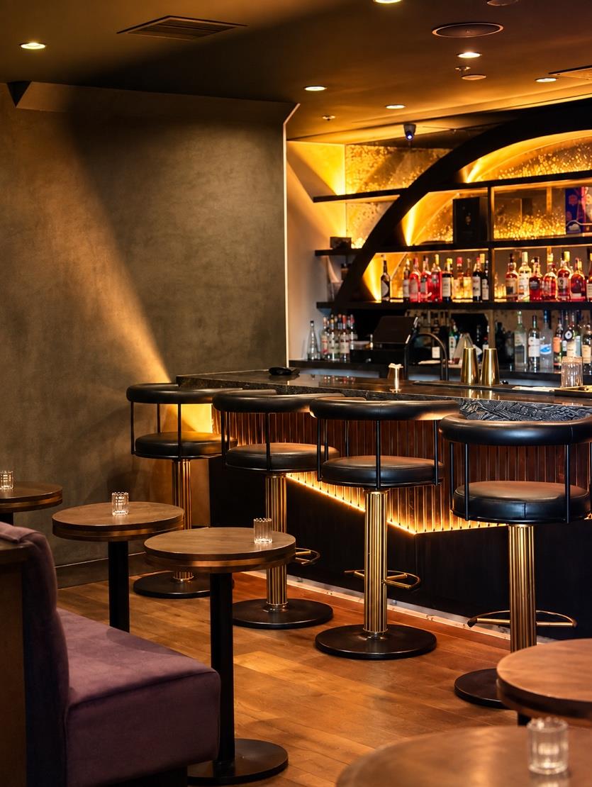 Room 214 bar seating with warm lighting