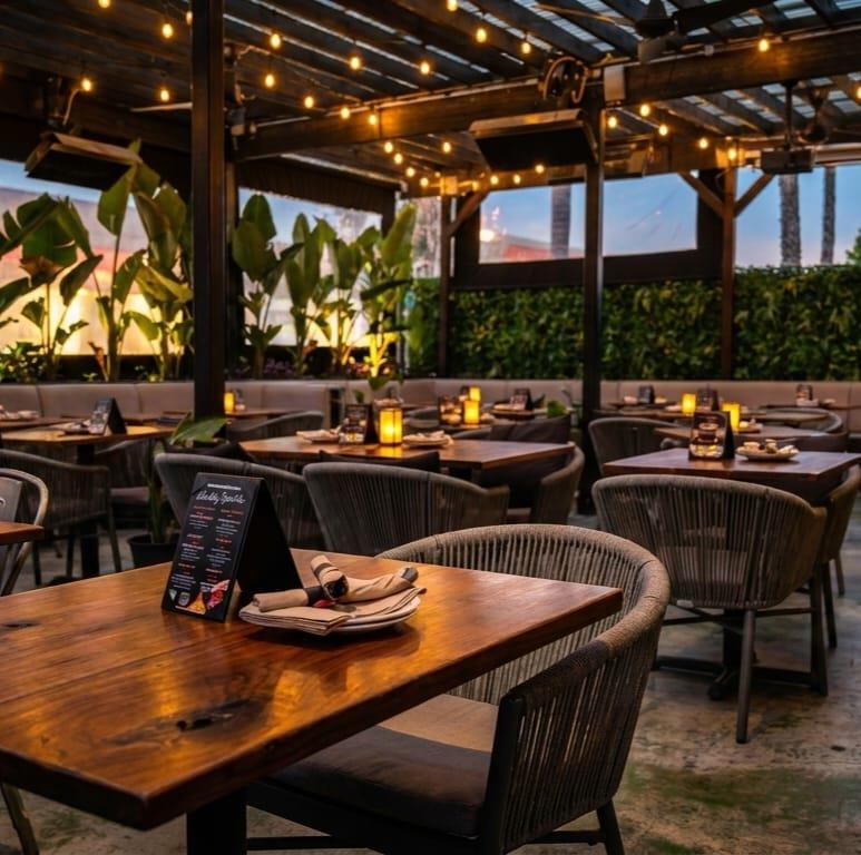 The Chicken Koop Downey Patio at dusk with string lights